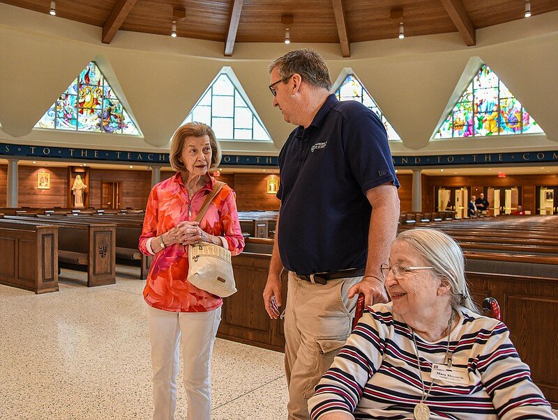Mary Meystrik, at right, beams with pride as she listens to her son Steve Meystrik talk about some of the features of the recent renovation at the Cathedral of St. Joseph to Nancee Allen during a tour of the church Monday, Aug. 7, 2023. Mary and Nancee are both residents at Heisinger Bluffs who were part of a group of about 20 to see the work recently completed. Steve serves as stewardship coordinator for the parish and lead the group and explained several of the new features and amenities.